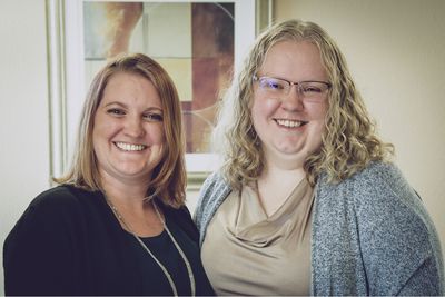 Christa Wilson and Cheree Turner, business owners of Your Accoutant LLC, posing with welcoming smiles on their faces