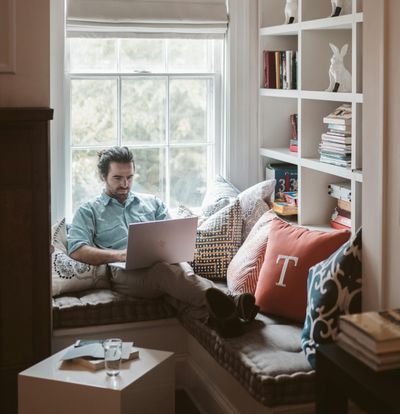 Landlord, property owner working from home on his laptop