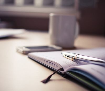 Yearly planner, mug, and phone