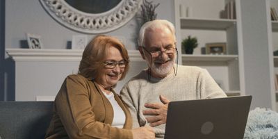 Elated old married couple receiving quality tax plan from Your Accountant LLC